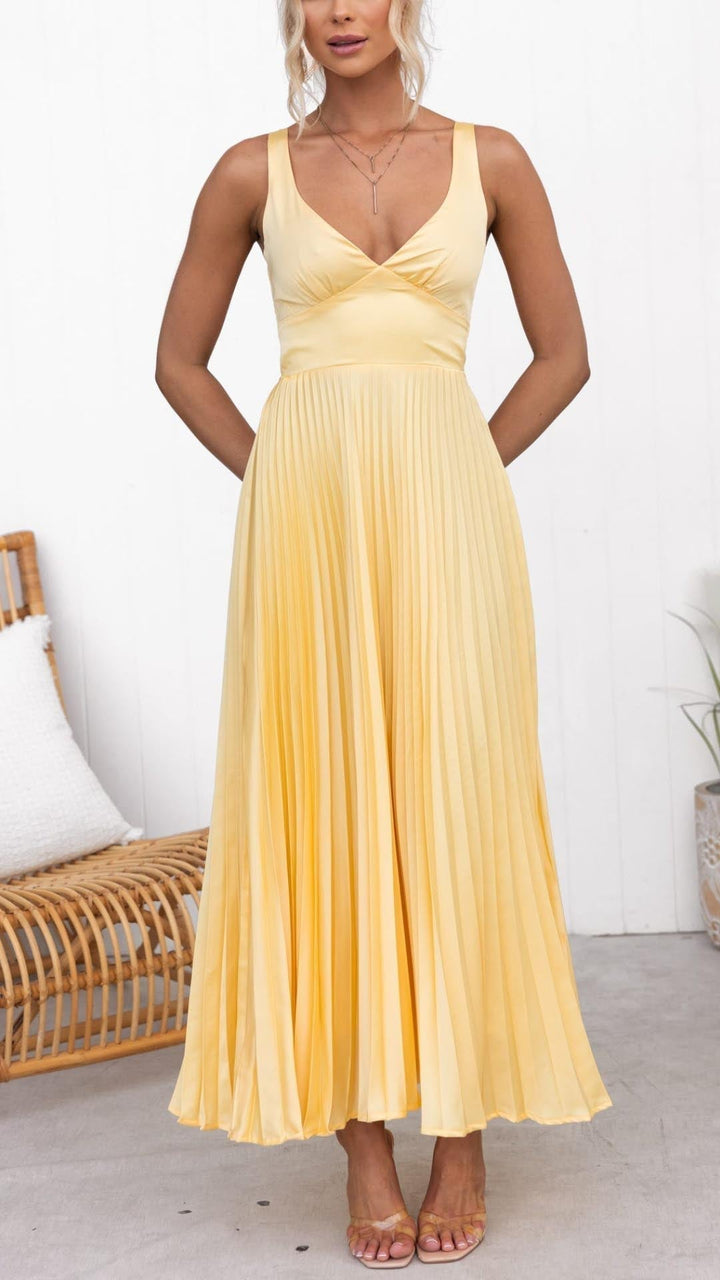 Women's chic gold V-neck pleated maxi dress, flowy and long, ideal for elegant summer evening events.