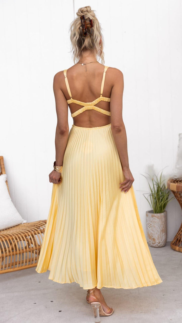Stylish women's gold V-neck flowy pleated maxi dress, an elegant long summer vacation or evening party dress.