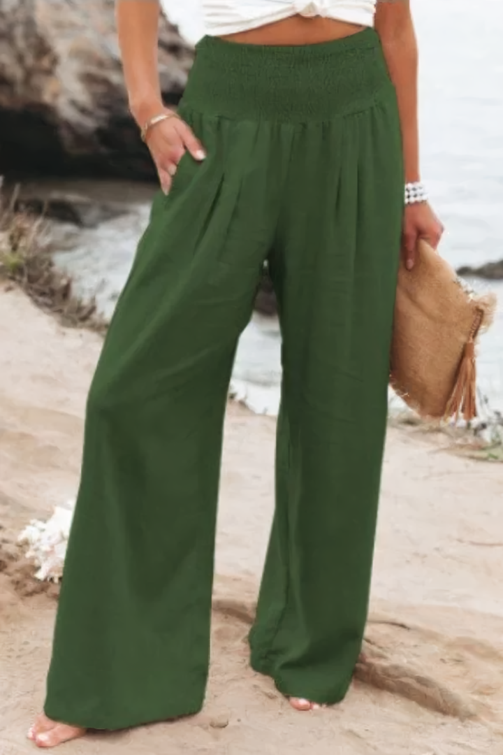 Model wearing elegant flowy palazzo pants, highlighting the wide-leg cut and comfortable, versatile style.