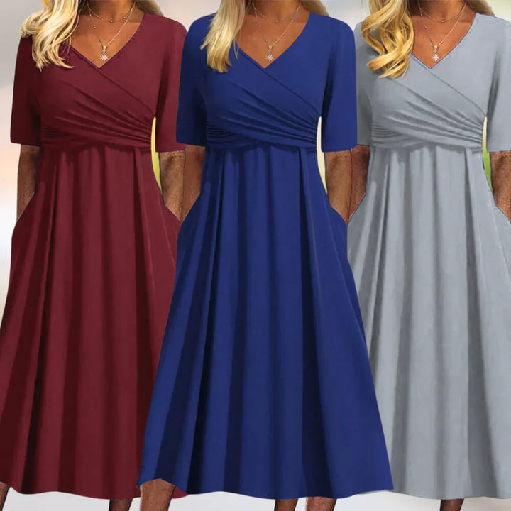 Chic women's A-line midi dress with V-neck & pockets. Versatile sleeveless design for elegant spring & summer fashion.