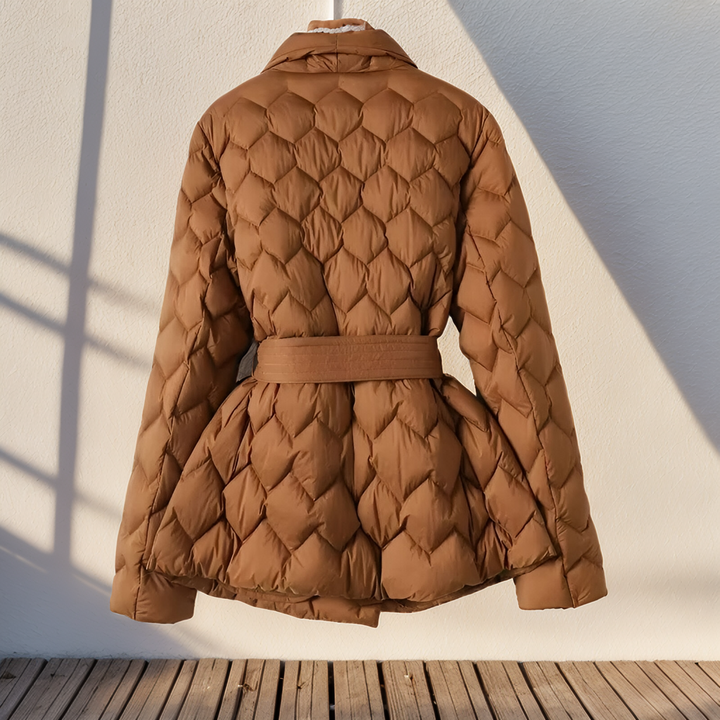Stylish women's padded winter jacket with a flattering belted waist, perfect for elegant fall & winter fashion.