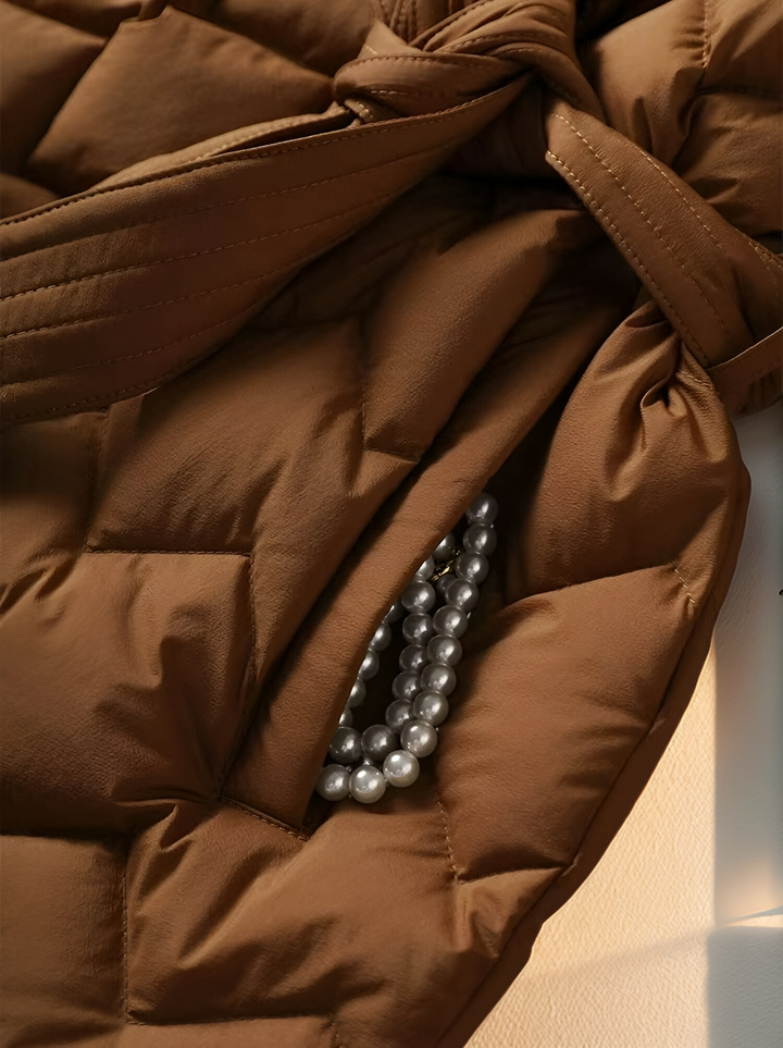 Warm women's padded winter outerwear. Elegant, stylish, & perfect for various cold weather occasions.