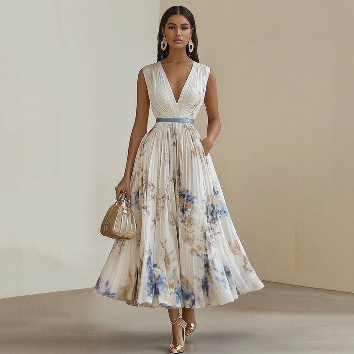 White elegant V-neck sleeveless midi dress. Flattering summer occasion wear with a flowy silhouette.
