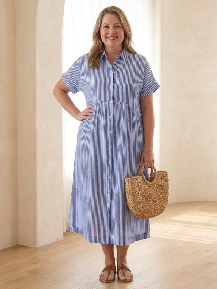 Close-up of vertical stripes and functional buttons on a women's short sleeve midi dress.