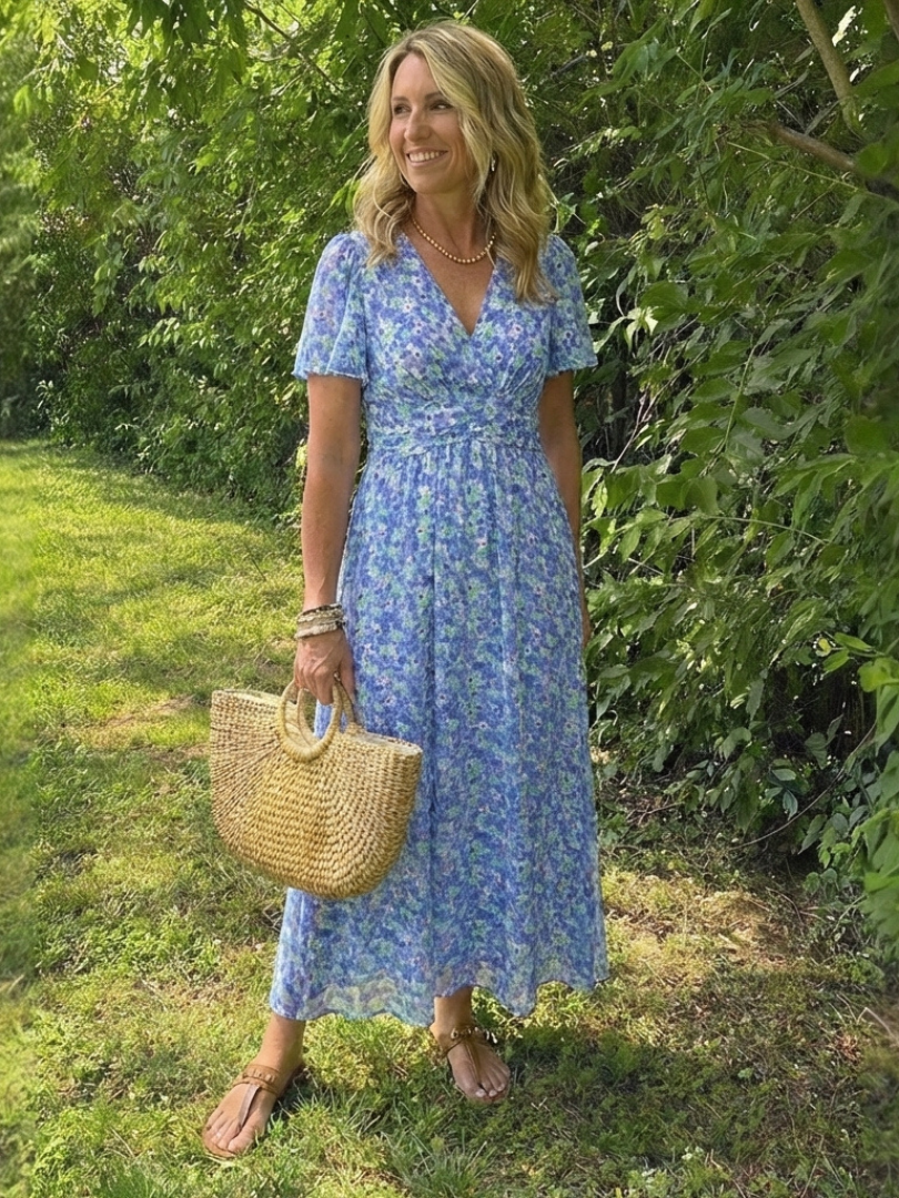 Elegant floral V-neck maxi dress for women, featuring short sleeves and a flowy fit for summer fashion.