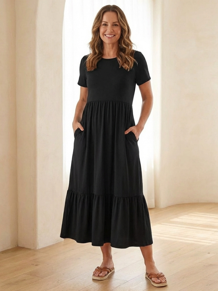 Women's round neck short sleeve tiered midi dress, perfect for casual summer wear. Comfortable relaxed fit.