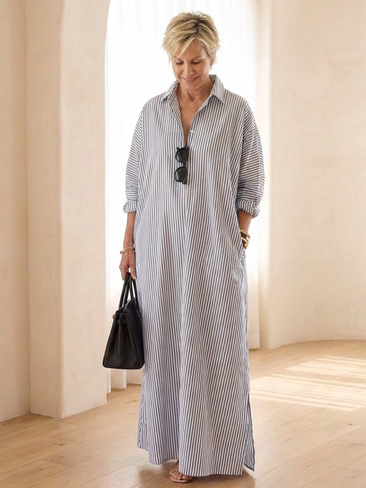 Back view of a women's striped long sleeve maxi shirt dress, showcasing its flowy design for comfortable summer wear.