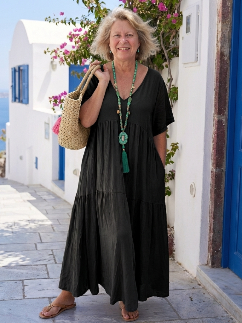 Comfortable women's short sleeve tiered maxi dress, relaxed fit and flowy for elegant summer and vacation wear.