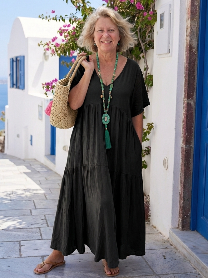 Comfortable women's short sleeve tiered maxi dress, relaxed fit and flowy for elegant summer and vacation wear.
