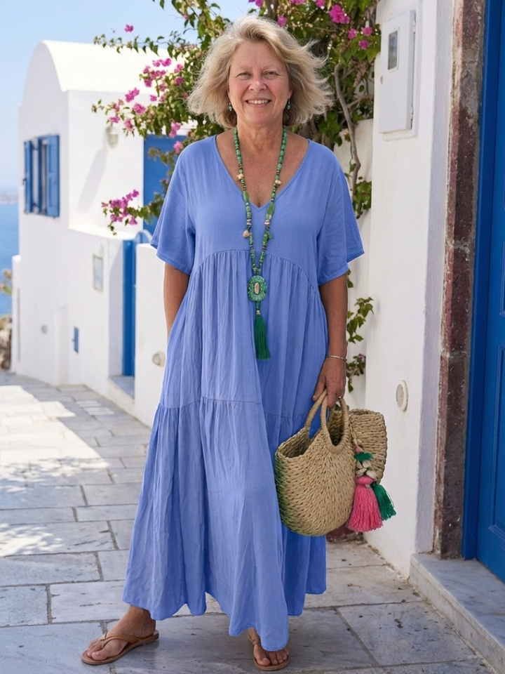 Flowy relaxed fit women's short sleeve tiered maxi dress, perfect for comfortable summer fashion or beach travel.