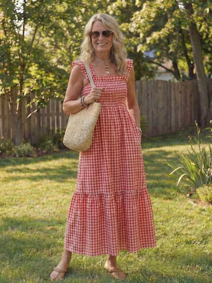 Casual women's gingham print maxi dress featuring elegant flutter sleeves and a tiered skirt, perfect for summer.