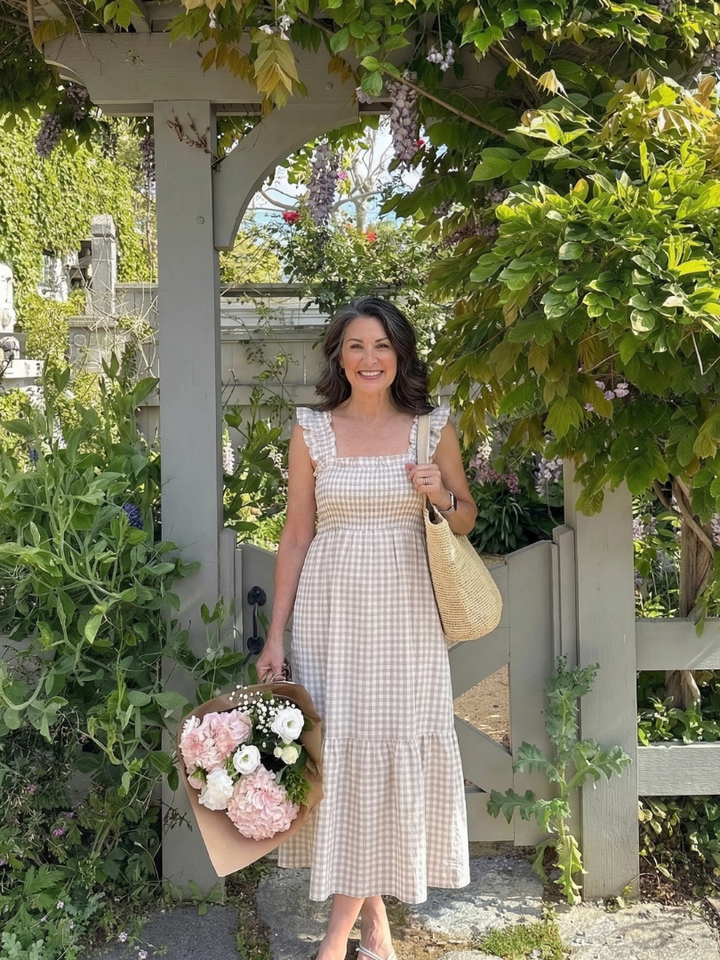 Women's comfortable pull-on smocked bodice gingham maxi dress with flutter sleeves for easy summer style.