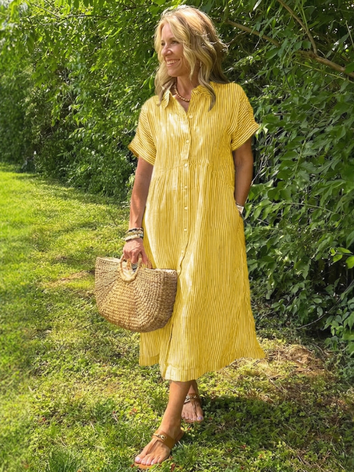 Stylish women's short-sleeve striped midi dress with a functional button front, great for casual summer looks.