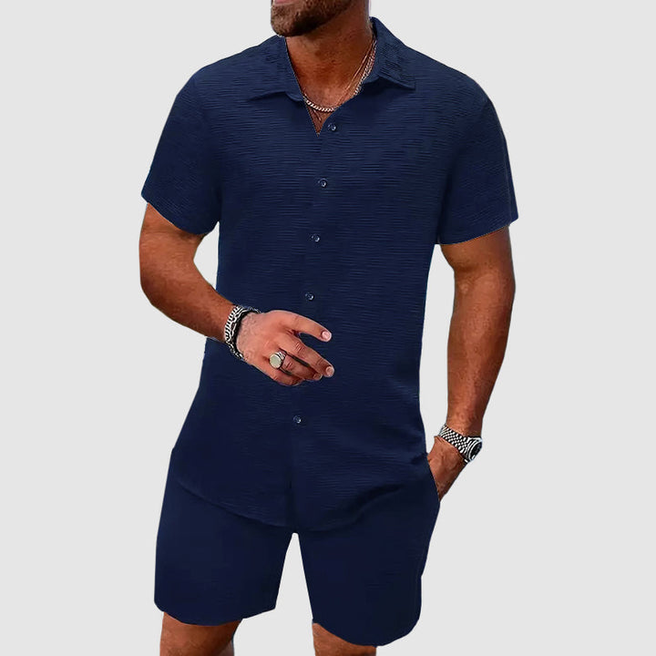 Relaxed fit men's two-piece set: button-down shirt and comfortable shorts for spring fashion.
