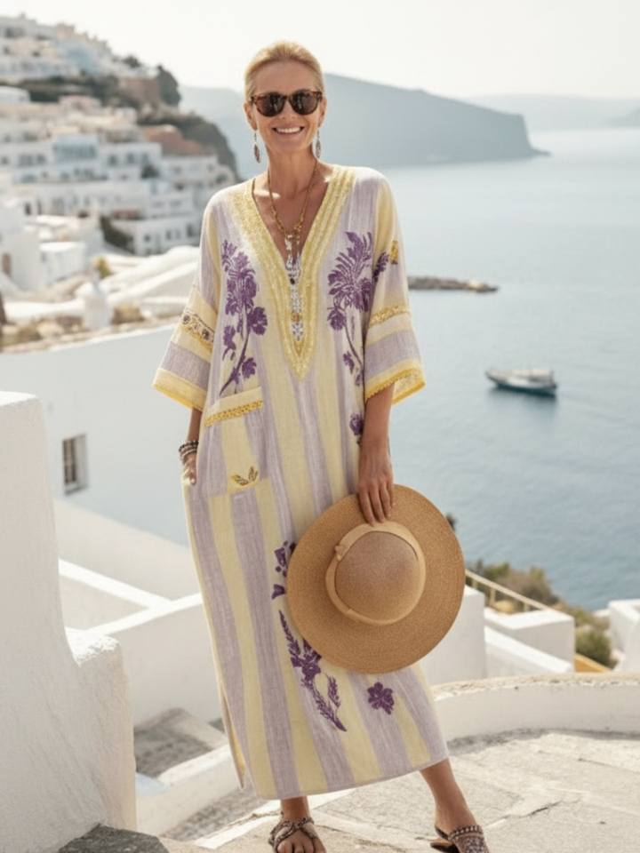 Relaxed fit women's maxi dress featuring a chic beige striped floral print and a flattering V-neck, ideal for summer.