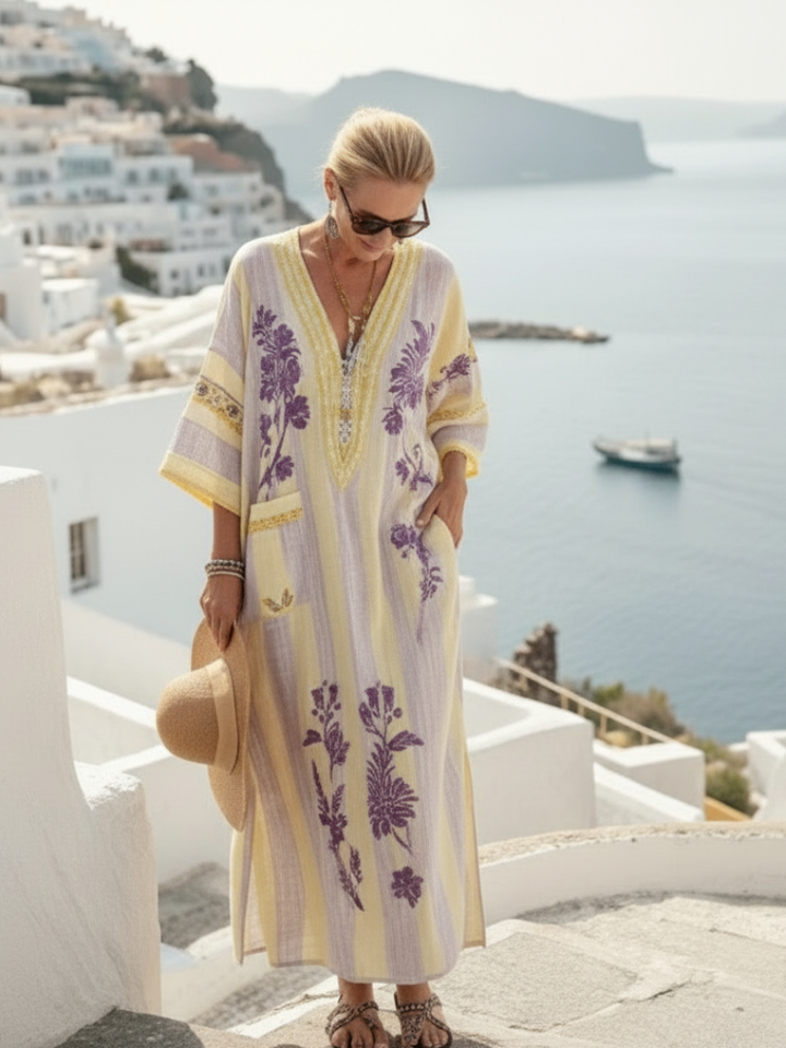 Beige women's striped floral V-neck maxi dress with half sleeves, a casual and comfortable summer outfit.