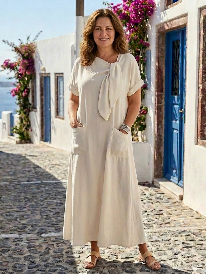 Women's round neck short sleeve maxi dress with pockets. Flowing, comfortable for casual summer everyday wear.