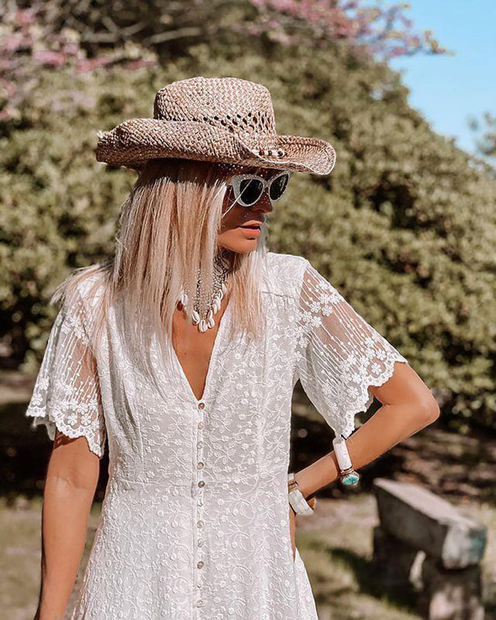 Flowy white bohemian summer maxi dress. Elegant women's fashion for beach, holidays & casual chic everyday wear.