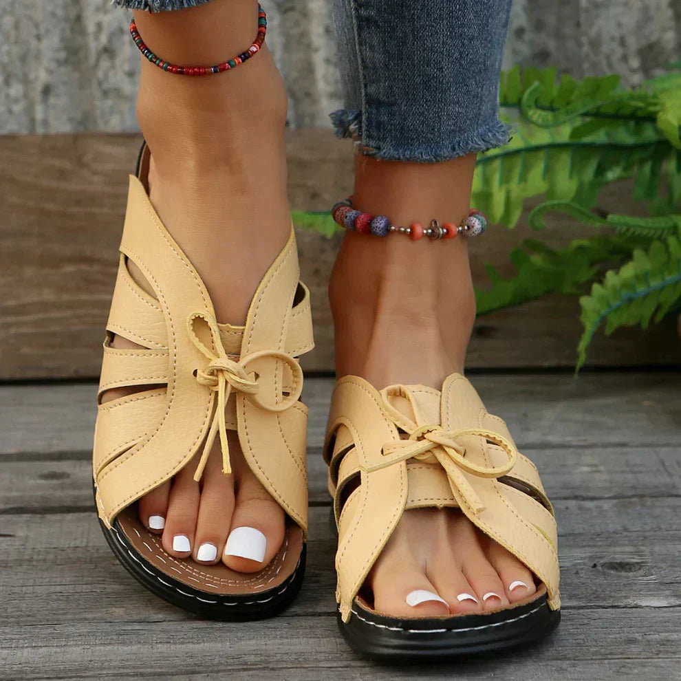 Women's comfortable wedge sandals featuring a stylish knot detail, ideal for casual and summer fashion.