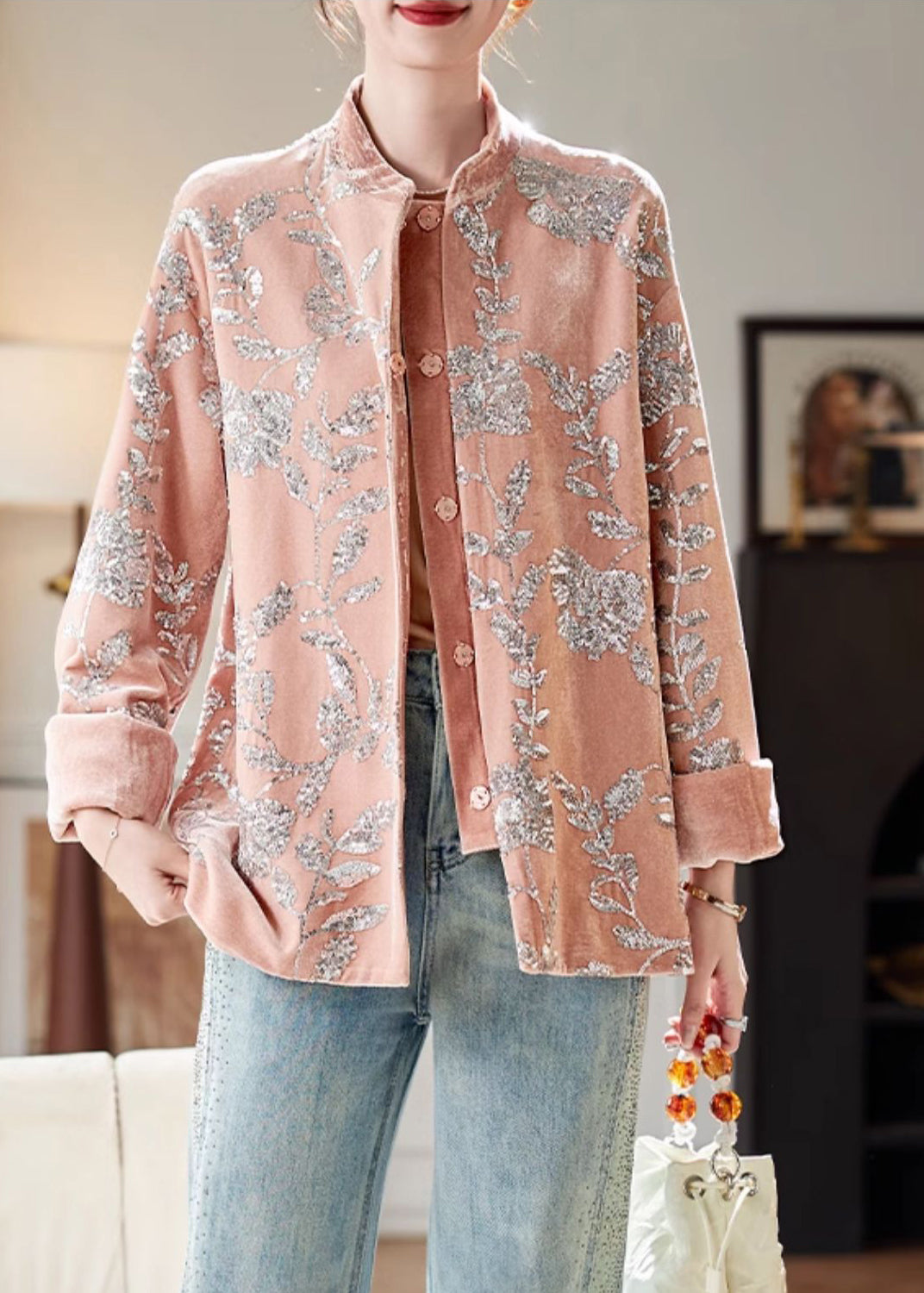 Women's long sleeve coat in a chic design. Adorned with eye-catching pink sequin buttons for stylish party wear.