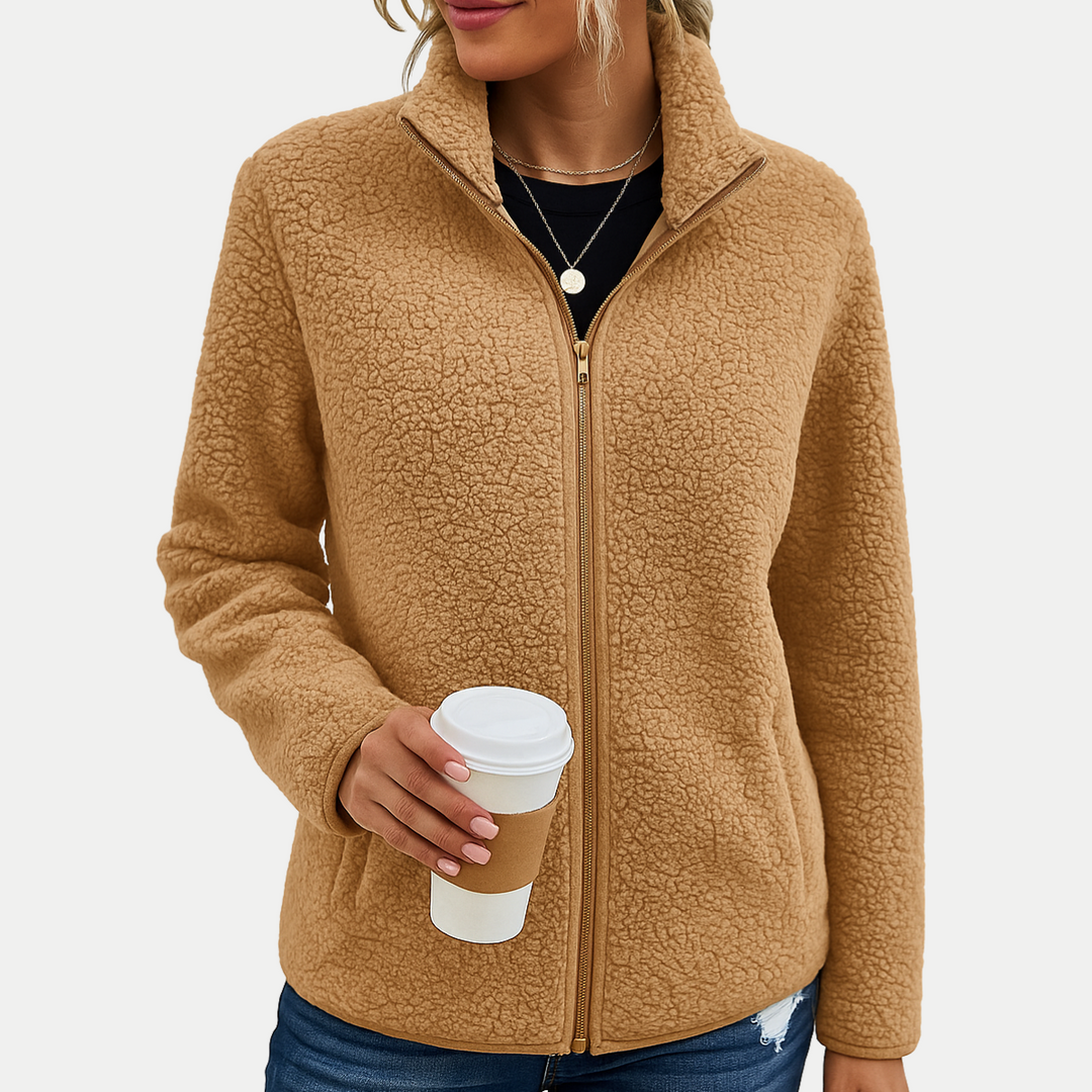 Soft women's long-sleeve fleece jacket featuring a unique textured pattern, full zip front, and high collar.
