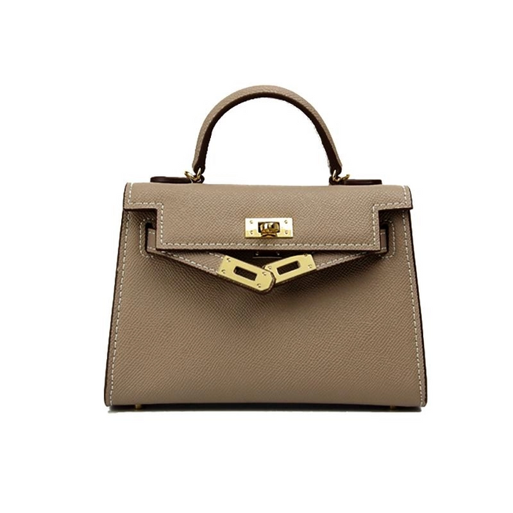 Fashionable black top handle bag, structured silhouette, and luxurious gold lock. A must-have women's accessory.