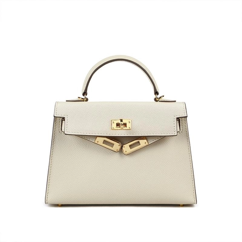 Elegant black structured purse with a strong top handle and eye-catching gold lock. A timeless women's accessory.