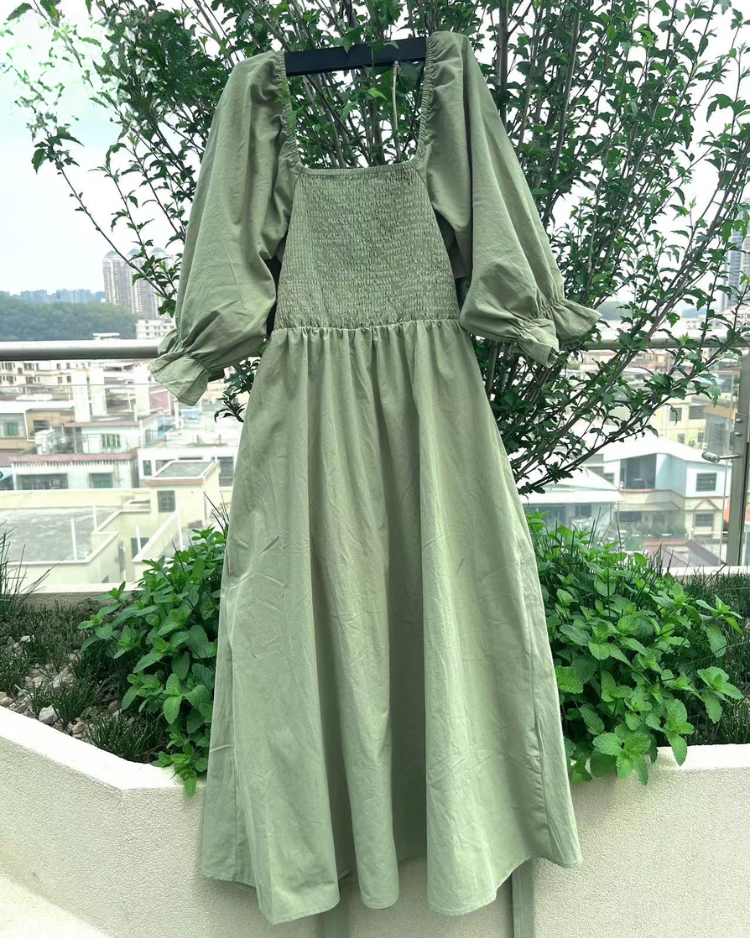 Elegant women's midi dress, featuring chic French ruffle sleeves, ideal for formal fashion events.