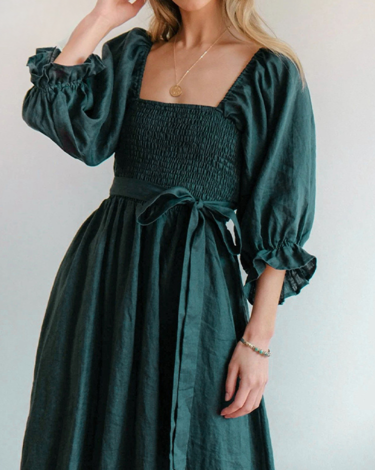 Women's elegant midi dress showcasing stylish French ruffle sleeves, a chic formal look.