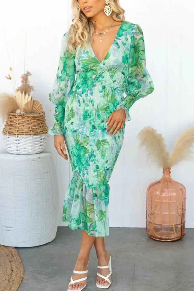 Beautiful women's elegant midi dress with a colorful floral print. Great for spring & summer fashion.