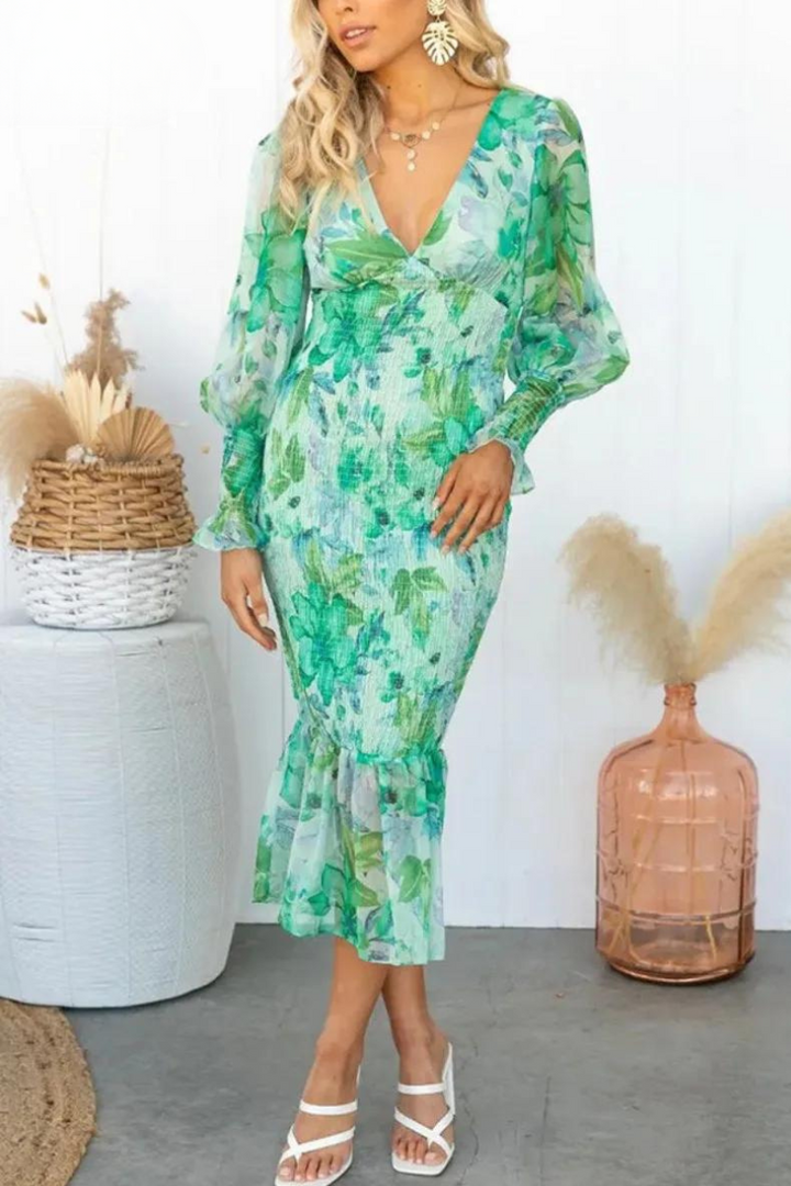 Beautiful women's elegant midi dress with a colorful floral print. Great for spring & summer fashion.