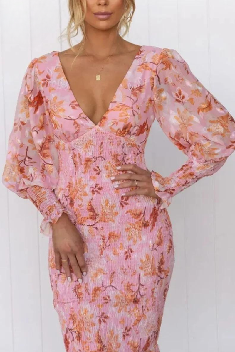 Casual women's floral print midi dress with elegant design. A breezy summer dress for any occasion.
