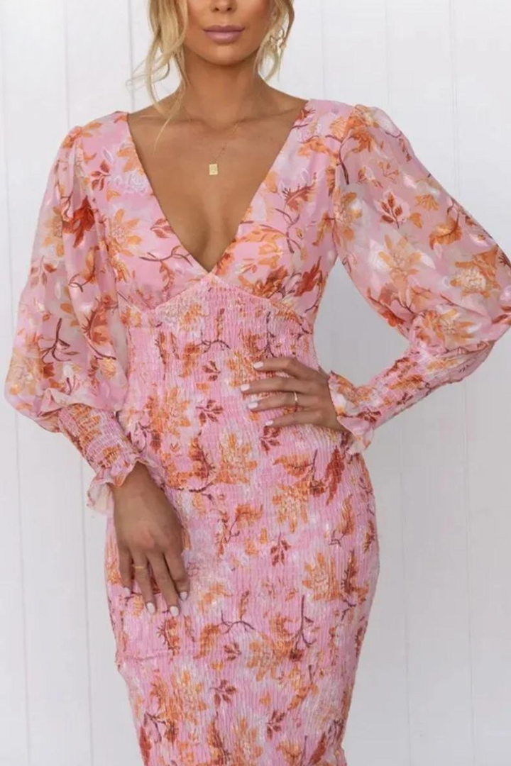 Casual women's floral print midi dress with elegant design. A breezy summer dress for any occasion.