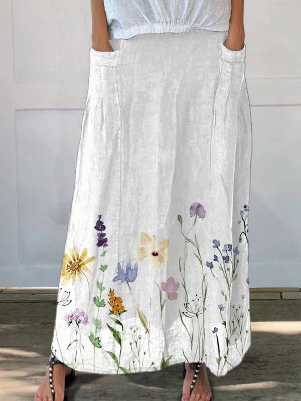Women's watercolor meadow print A-line midi skirt with pockets. Comfortable & stylish for spring & summer fashion.