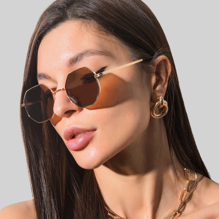 Stylish women's polygonal sunglasses with sleek metal frame. Perfect summer shades & fashion accessory.