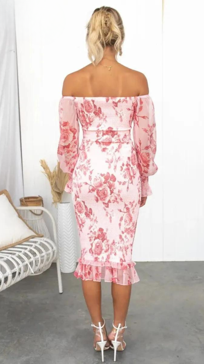 Detailed view of the elegant floral pattern & romantic off-shoulder ruffles on a women's midi dress.