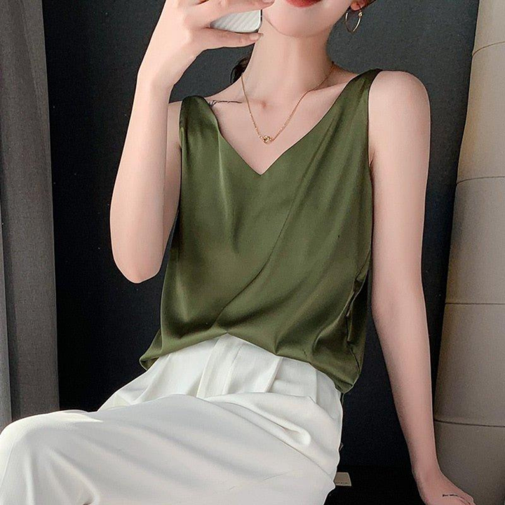 Women's draped V-neck sleeveless tank top, elegant & versatile for smart casual outfits.