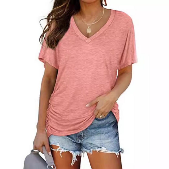 Comfortable women's loose fit V-neck top. An everyday essential, this stylish blouse offers casual elegance.