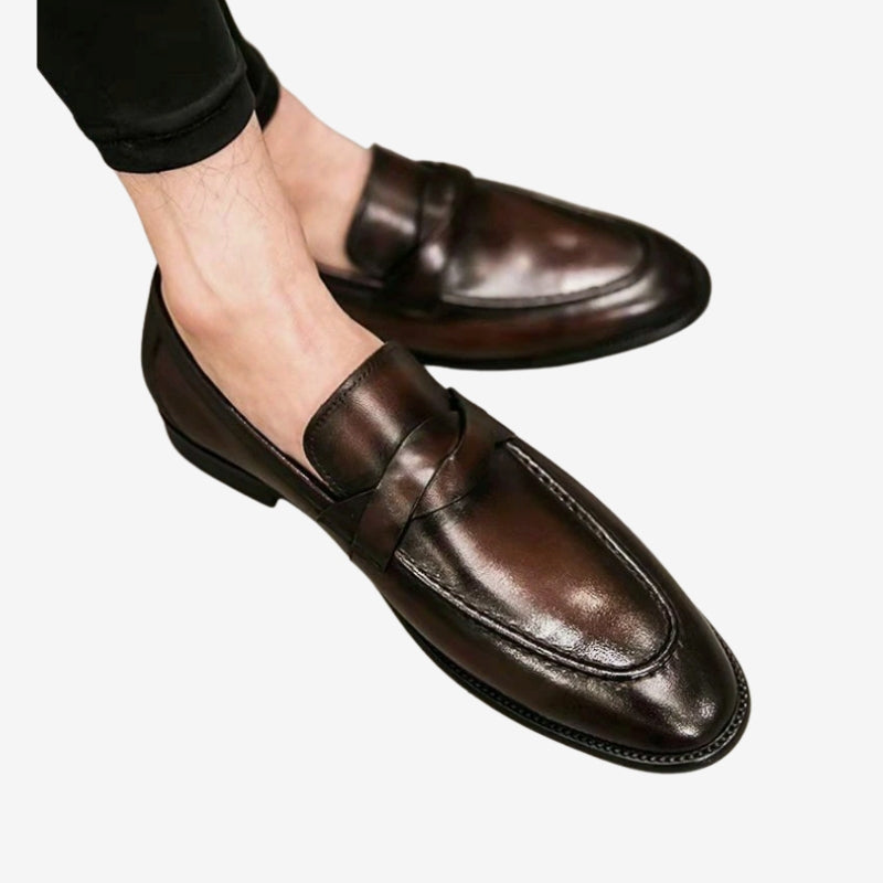 Sleek, polished black leather men's penny loafers with comfortable slip-on design for versatile style.