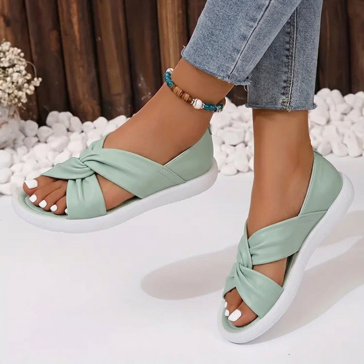 Comfortable women's twist crossover sandals, cushioned, open-toe slip-on footwear for elegant everyday summer wear.