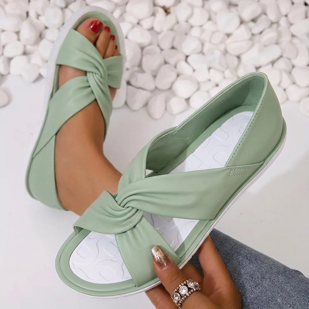 All-day comfort women's cushioned twist crossover sandals; versatile summer footwear for elegant & casual occasions.