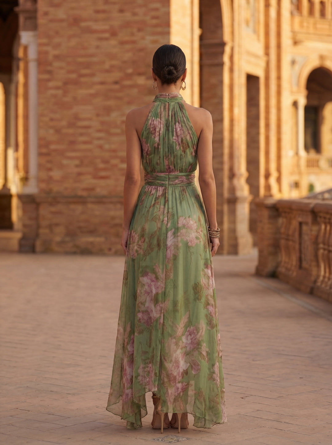 Chic A-line women's midi dress featuring a stylish halter neck and vibrant floral pattern for summer.