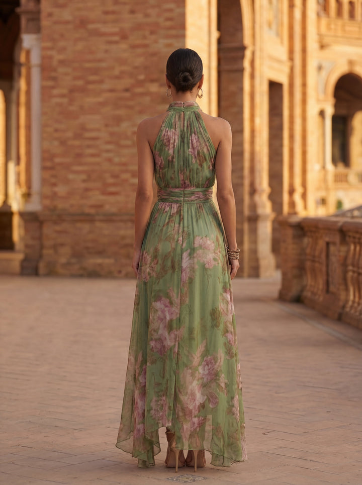 Chic A-line women's midi dress featuring a stylish halter neck and vibrant floral pattern for summer.