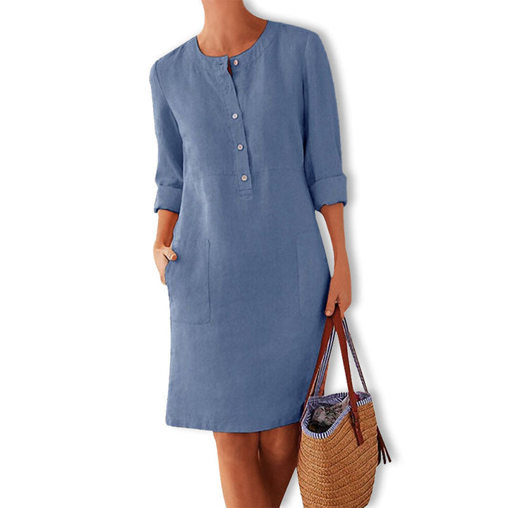 Women's relaxed fit button front summer dress with practical pockets, ideal for casual wear.