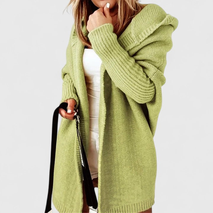 Comfortable women's oversized knit cardigan, perfect for a cozy travel outfit or casual everyday wear.