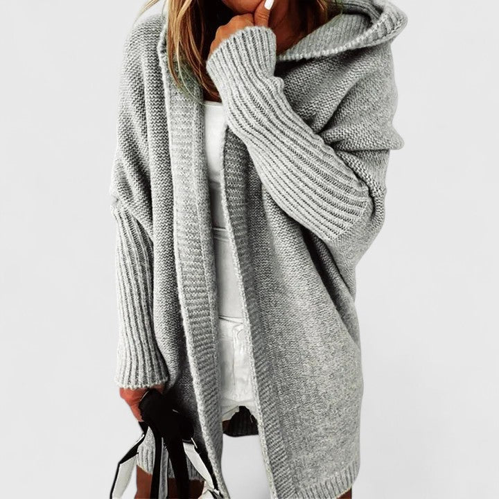 Women's long hooded oversized sweater cardigan, a comfortable knit for chic versatile layering in any season.