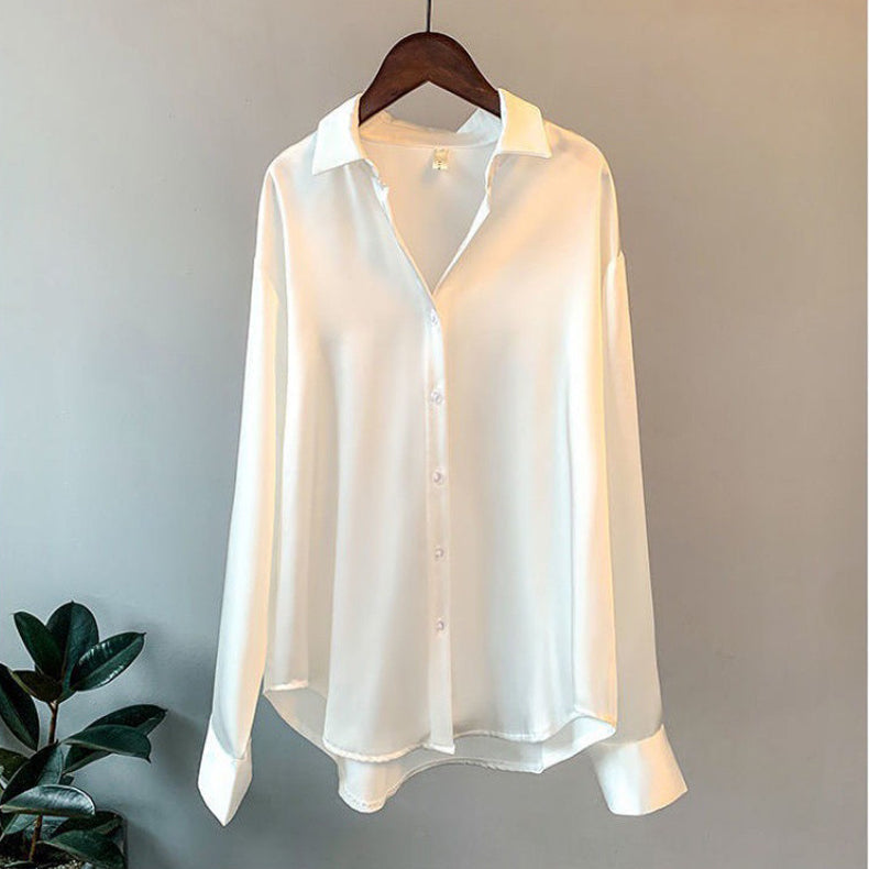 Elegant women's luxury blouse with long sleeves, perfect for sophisticated office wear or formal occasions.