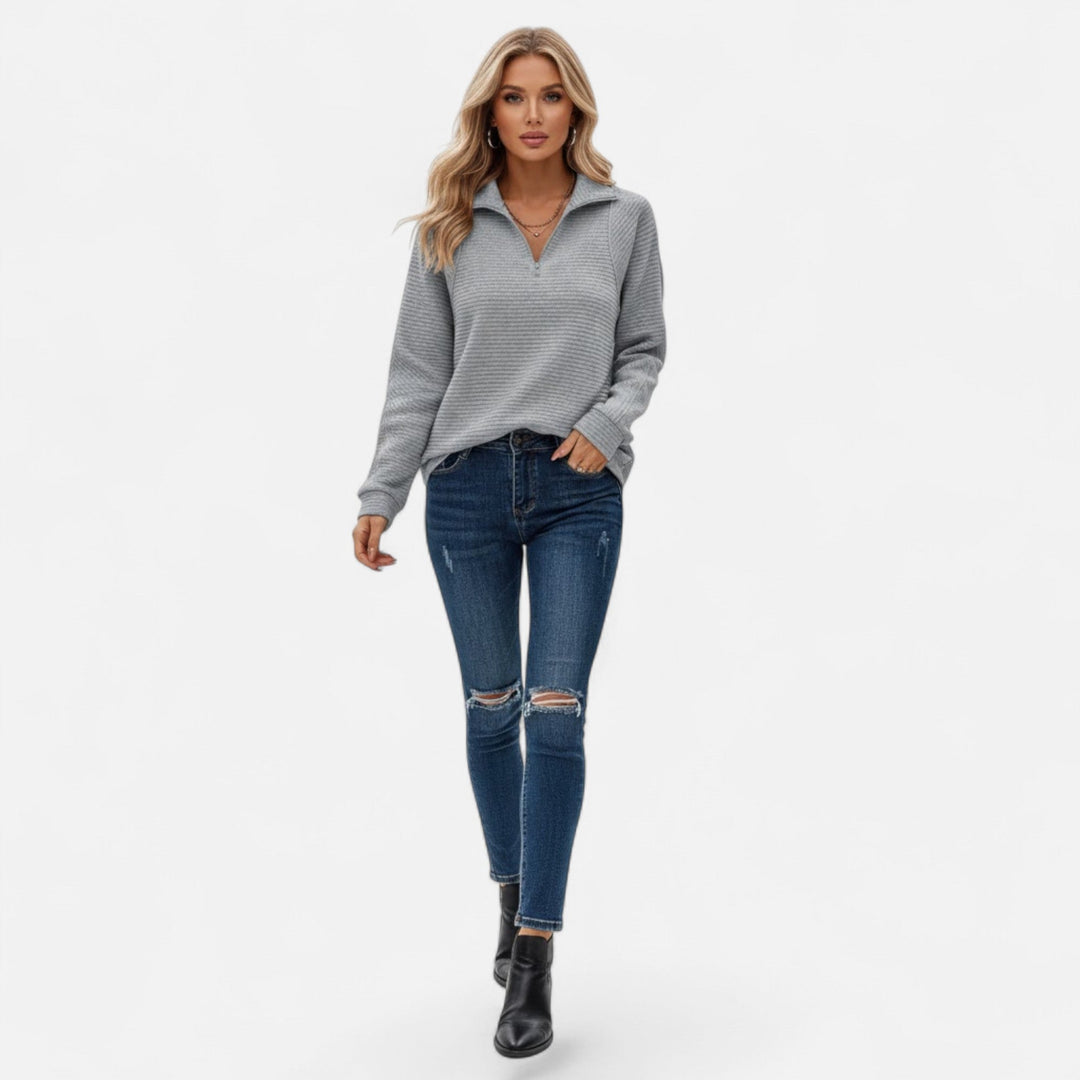 Everyday essential: Women's long-sleeve stand-collar pullover sweater with a modern zipper.