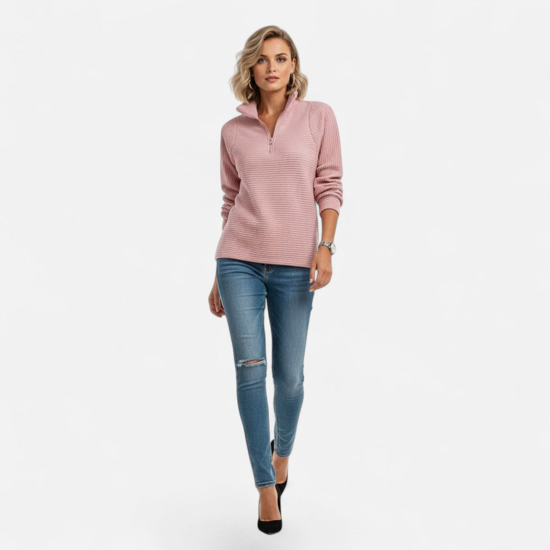 Cozy women's long-sleeve pullover, soft knit with a stand collar and stylish zipper detail.