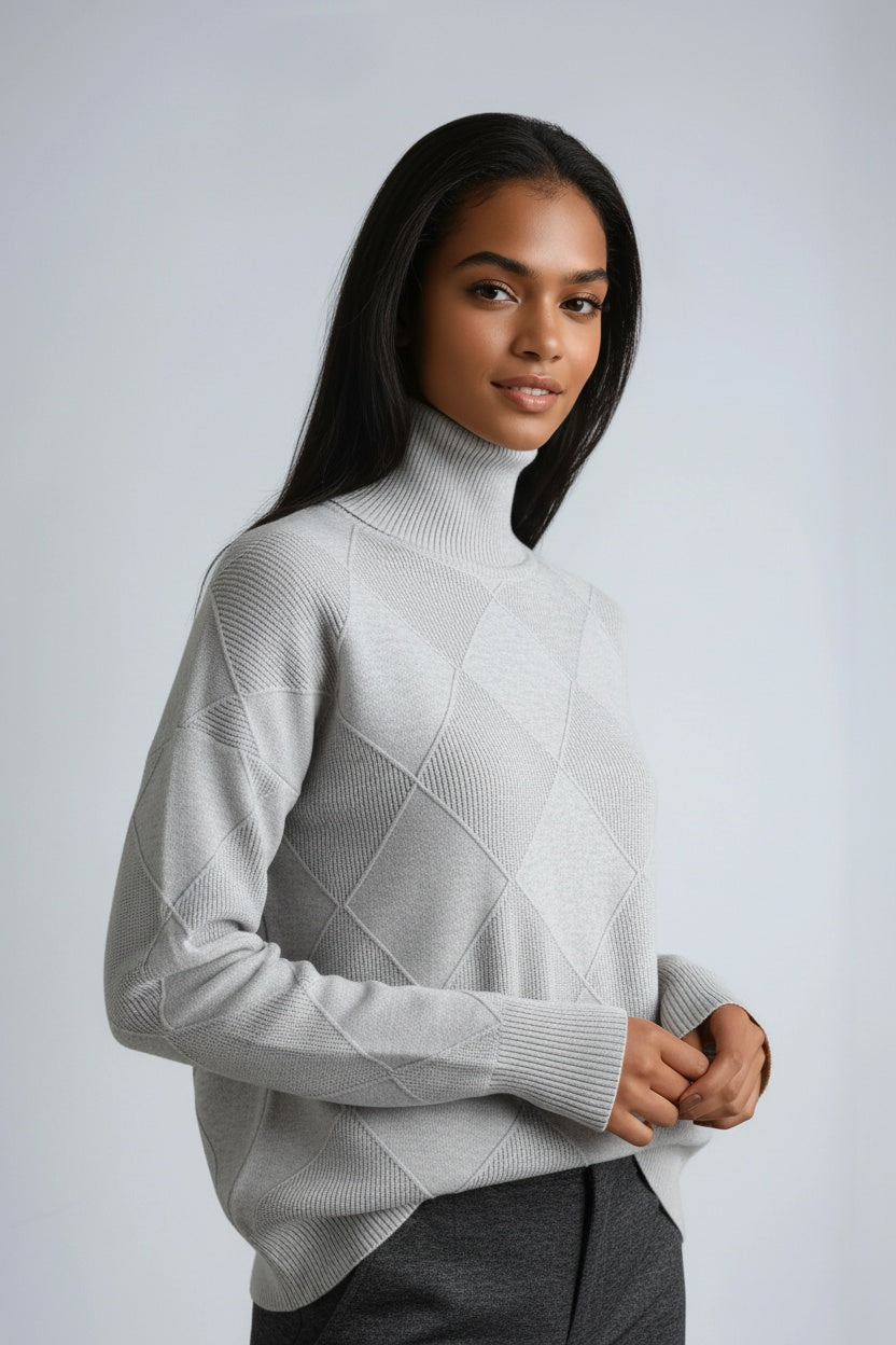 Warm women's turtleneck sweater with a distinct diamond knit pattern. A cozy and stylish winter jumper.